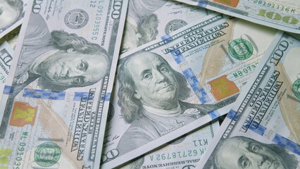 Piles of U.S. Hundred Dollar Bills Spread Out on the Table, Ready for Business Transactions