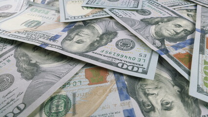 An assortment of diverse U.S. Dollar bills thoughtfully arranged, highlighting a financial theme