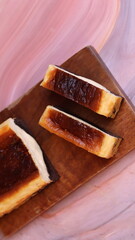 Photo of Burnt Chocolate Melted cake that has been cut and placed on a wooden box stand. Photo with various camera angles 45 degrees, front view and flat lay. Portrait and landscape aspect ratio.
