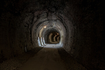 Abandoned stone tunnel on the historic Usui Pass Railway.