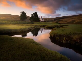 Fototapeta premium A serene church reflected in a calm river, set against a beautiful sunset. The picturesque landscape evokes a sense of tranquility