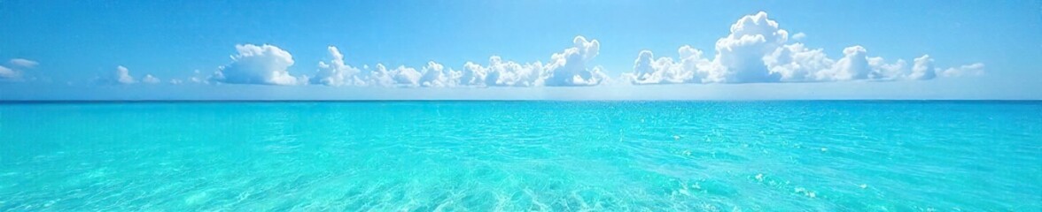 Obraz premium Shimmering turquoise water sparkles under a vibrant blue sky, creating a breathtakingly serene and captivating scene Perfect for travel, nature, and summer themes , majestic, breathtaking