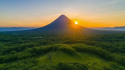 Aerial shot of a mountain peak at dawn during solstice, International Day of the Celebration of the Solstice, june