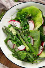 Green salad with asparagus and radish. Healthy eating.