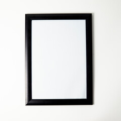 Blank picture frame mockup on a wall. Square orientation. Artwork template