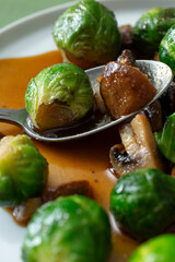 A closeup view of an entree of marinated Brussels sprouts.