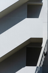 white concrete stair case beside the building