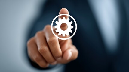 A hand points to a gear icon.