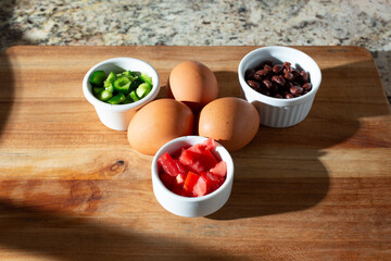 A view of ingredients for a Southwestern style omelet.