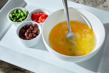 A view of ingredients for a Southwestern style omelet.