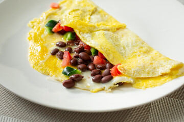A view of a Southwestern omelet on a plate.