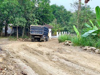 The condition damaged roads during the rainy season which are used by many vehicles such as cars...