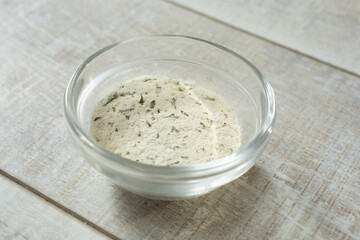 A view of a condiment cup of ranch dressing powder.