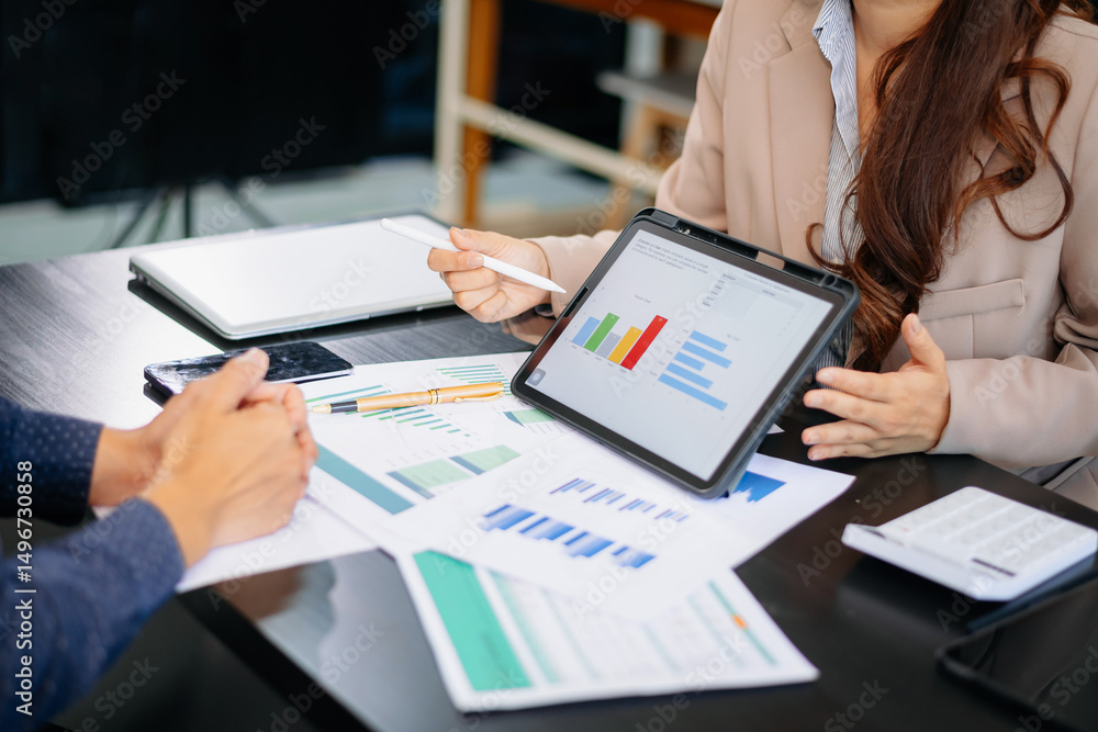 Poster business documents on office table with smart phone and calculator digital tablet and graph business