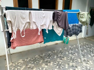 Close up different clothes drying on laundry line on a summer day