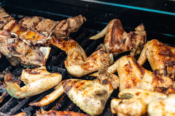 Cooking chicken wings in barbecue