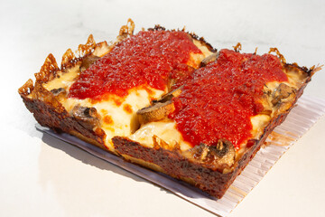A view of a mushroom Detroit style pizza.