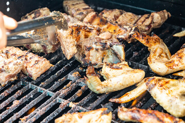 Cooking chicken wings in barbecue