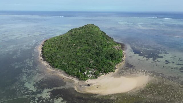 Ilot Fourneau In Port Louis Mauritius Island Mauritius. Turquoise Ocean Waves Gently Crashing On Tropical Beach. Coast Clouds Sky Seaside Summertime. Outdoor Seaside Tropical Environment.
