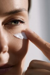 Close-up of woman applying facial cream (2)