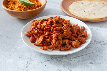 A view of a plate of al pastor meat.