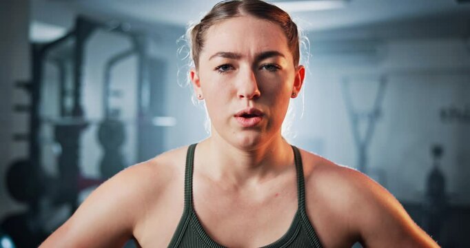 Woman, sweat and face with pride for exercise, intense workout and wellness as bodybuilder. Female person, breathe and break as athlete for health, challenge and training for fitness or sport in gym