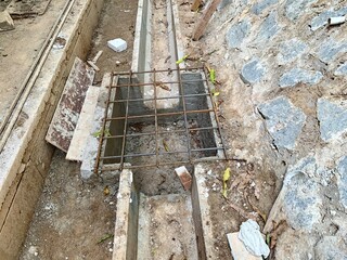 Close up iron frame installed on the drainage channel section, as a drainage cover. The process of...