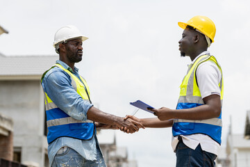 Team Construction or engineering group and worker.  Concept Restart and new Normal Two engineer...