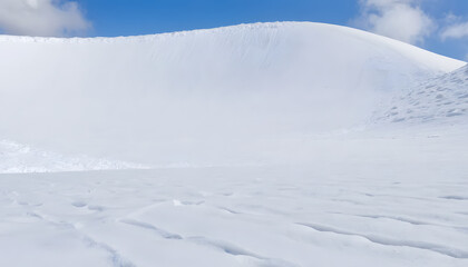 Snowy winter mountains with trees and clouds in a frozen landscape
