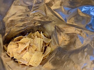 Close up of corn chips snack in a plastic package. This is crispy, crunchy, and delicious. Suitable...