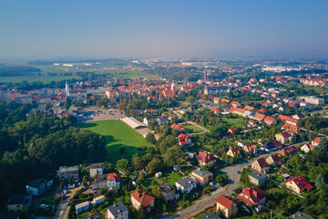Aerial view of European small town. Drone view of urban landscape with residential building, green parks and city streets