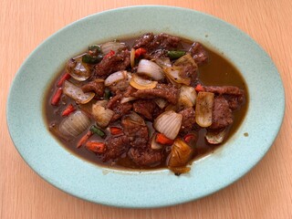 Black pepper beef on the plate. Delicious, tasty, and healthy food that making in the kitchen. Homemade food, healthy lifestyle