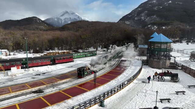 Train End Of The World In Ushuaia Tierra Del Fuego Argentina. Urban Scene Of Railway Train Station In Downtown District. Snowing Lake Glacial Frozen. Glacial. Ushuaia Tierra Del Fuego.