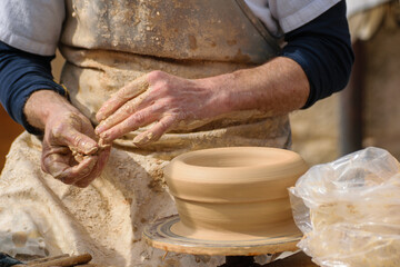 close up of ceramic artist working with natural clay, creative process of handmade pottery art background