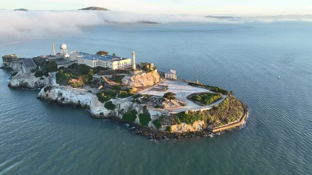 Alcatraz Island In San Francisco California United States. Lighthouse Standing Tall On Beach With Ocean Waves Crashing. Industry Skyline Skyscrapers Vibrant. Industry Cityscape.