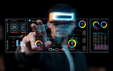 Futuristic businessman interacting with digital interface displaying global data analysis, charts, and metrics in a modern workspace environment