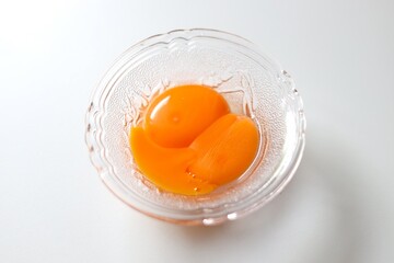 egg yolks in a clear bowl