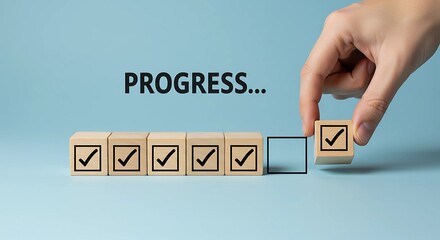 A Hand Placing Final Check mark Block for Task Progress