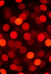 An abstract bokeh background featuring soft, blurred circular lights in enchanting shades of red and deep black.