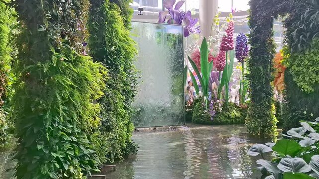 waterfall in and forest inside the flagship mall