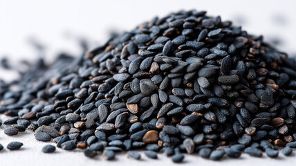 Obraz premium Black sesame seeds scattered neatly, showcasing their rich texture and color