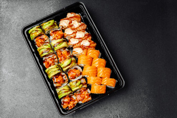 Delicious sushi platter with various rolls and fresh fish on display