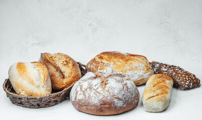 Variety of artisan breads displayed in a rustic setting