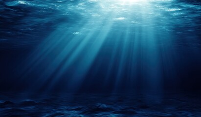 Dark Blue Ocean with Light Rays Shining Down: Underwater Scene of Serenity and Tranquility