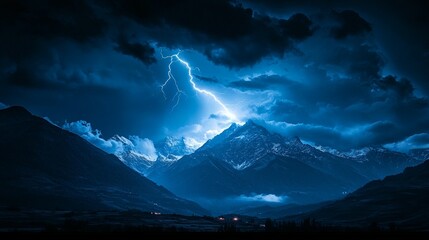 Dramatic mountain range under a stormy night sky with lightning