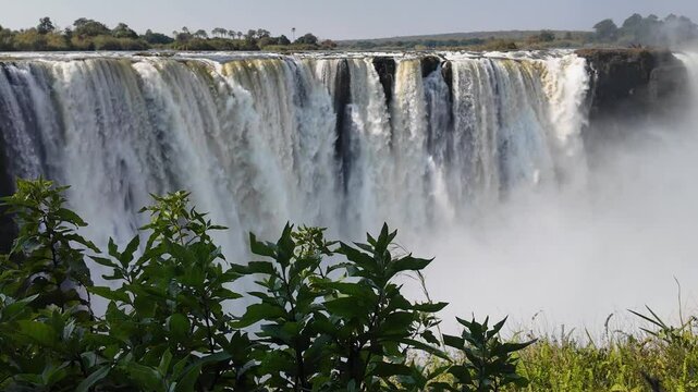 Victoria Falls In Livingstone Northern Rhodesia Zambia. Stunning Waterfalls Flowing In Natural Wonder Landscape. Landscape Sky Clouds Waterfall Tropical. Outside Waterfall Powerful Flow.