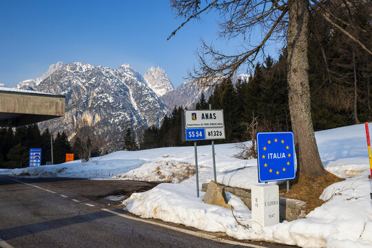 Italy Slovenia border crossing near Bovec during winter with snow and mountains