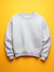 White sweatshirt on a vibrant yellow background.