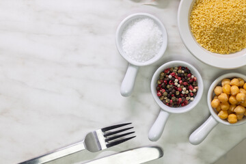 Ingredients and cutlery setting up a lunch on a marble table