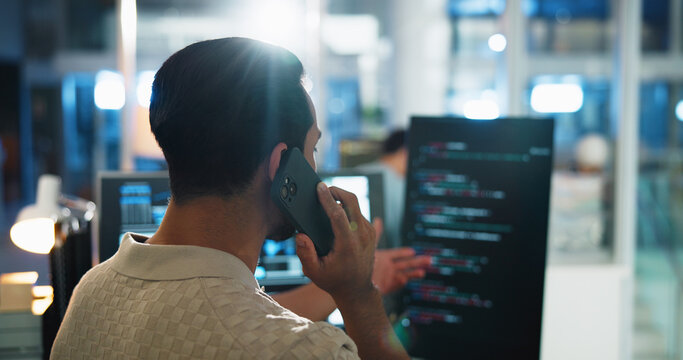 Office, man and developer with computer screen for phone call, coding consulting and back with contact. Night, business person and programmer with mobile for IT support, talking and software update
